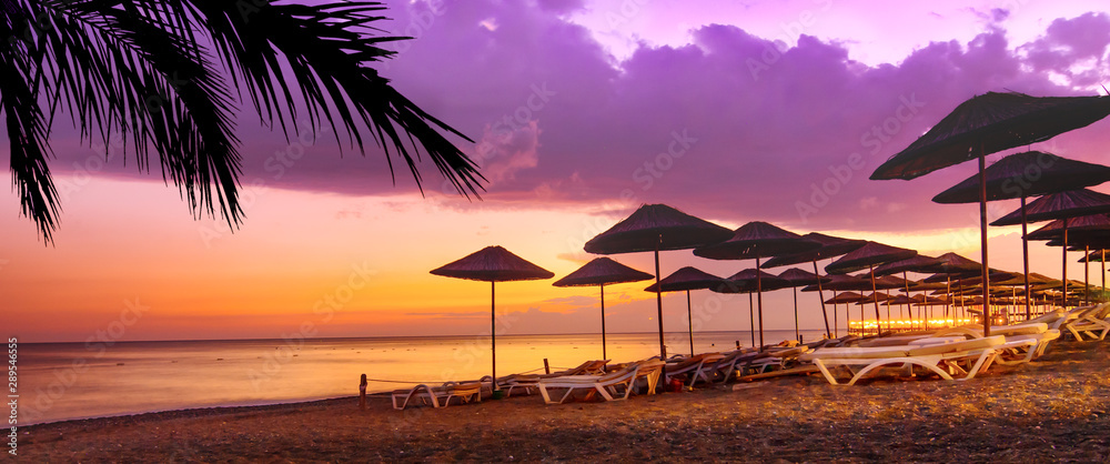 Coral purple sunset on the tropical beach