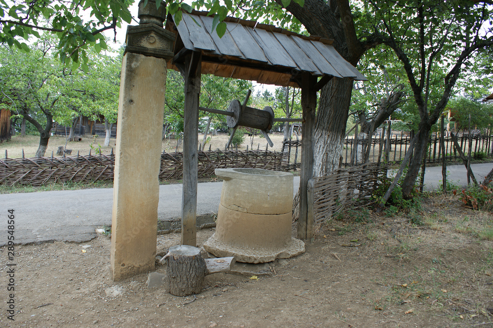 ancient stone well. antique well carved in solid stone ancient stone well. antique well carved in solid stone