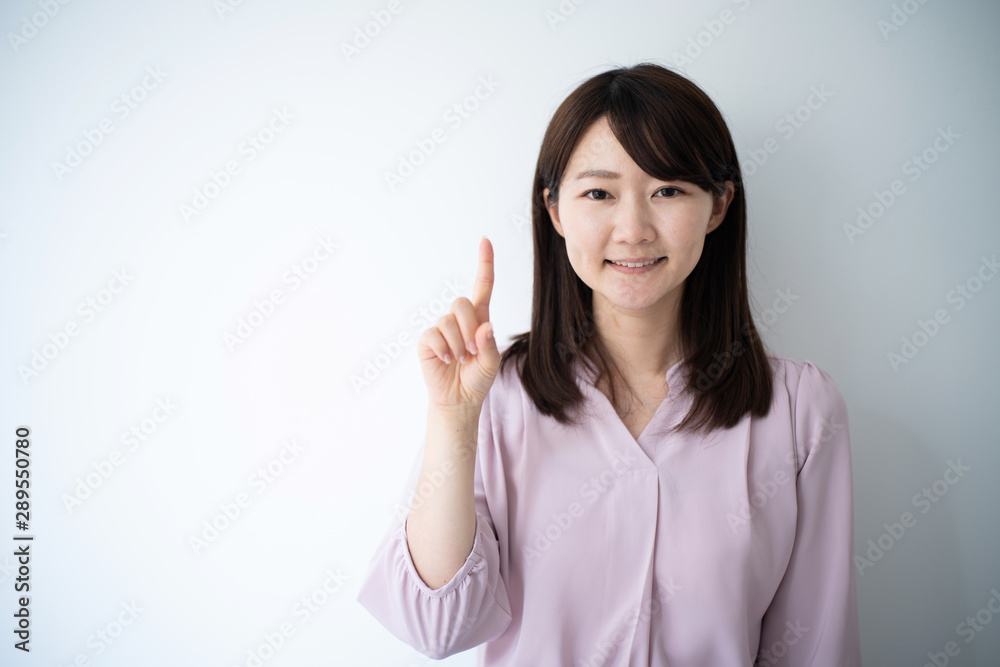 Young business woman explaining against white background Young business woman explaining against white background