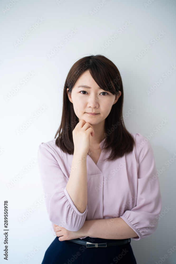 Young business woman thinking against white background Young business woman thinking against white background