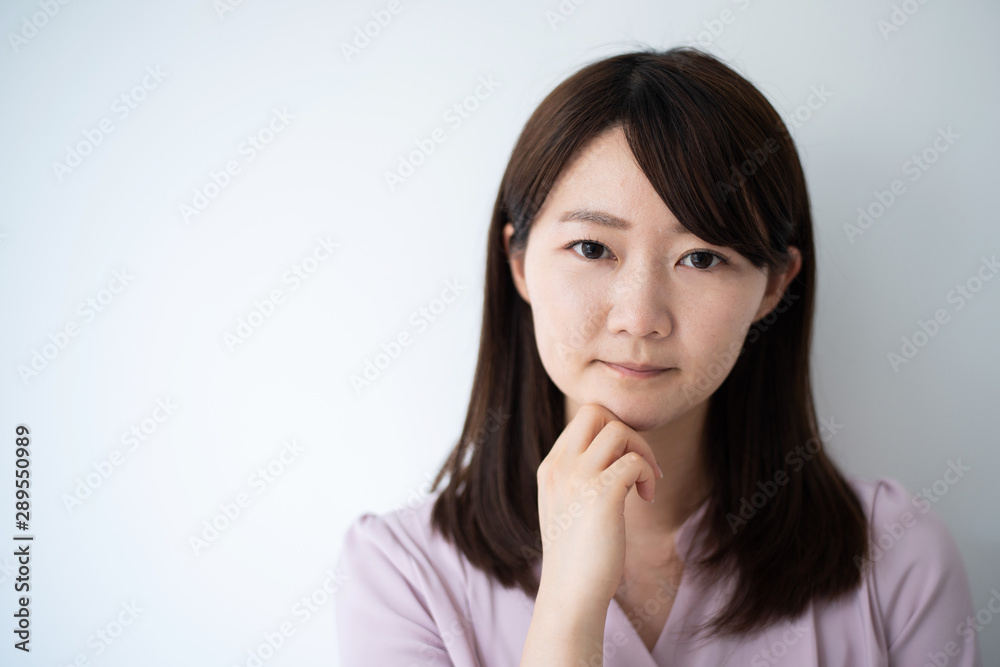 Young business woman thinking against white background Young business woman thinking against white background