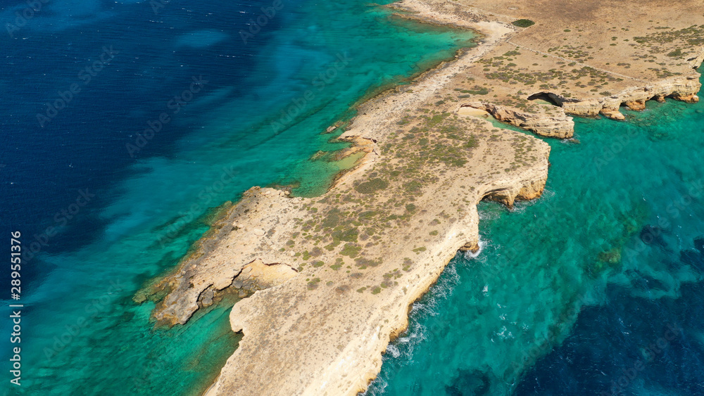 Obraz premium Aerial drone photo of small islet of Glaronisi with paradise emerald clear sea rocky beaches, Koufonisi island, Small Cyclades, Greece