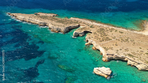 Aerial drone photo of small islet of Glaronisi with paradise emerald clear sea rocky beaches, Koufonisi island, Small Cyclades, Greece