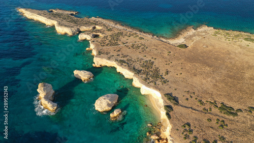 Aerial drone photo of small islet of Glaronisi with paradise emerald clear sea rocky beaches, Koufonisi island, Small Cyclades, Greece