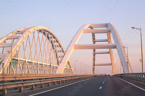 The large white arches of the Crimean bridge in Russia in the morning at dawn © Natalia