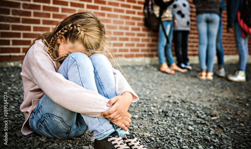 sad intimidation moment Elementary Age Bullying in Schoolyard