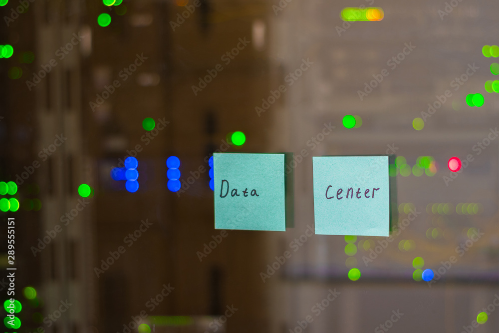 The inscription Data Center is glued to the glass of the computer center. Information technology concept. Colored paper stickers on the wall of the server room.