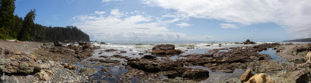 Beautiful Panoramic View of a rocky coast on the Juan de Fuca Trail during a sunny and cloudy summer day. Taken at Sombrio Beach, near Port Renfrew, Vancouver Island, BC, Canada. Beautiful Panoramic View of a rocky coast on the Juan de Fuca Trail during a sunny and cloudy summer day. Taken at Sombrio Beach, near Port Renfrew, Vancouver Island, BC, Canada.