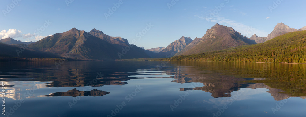 Beautiful Panoramic View of Lake McDonald with American Rocky Mountains in the background during a sunny summer day. Taken in Glacier National Park, Montana, United States of America.