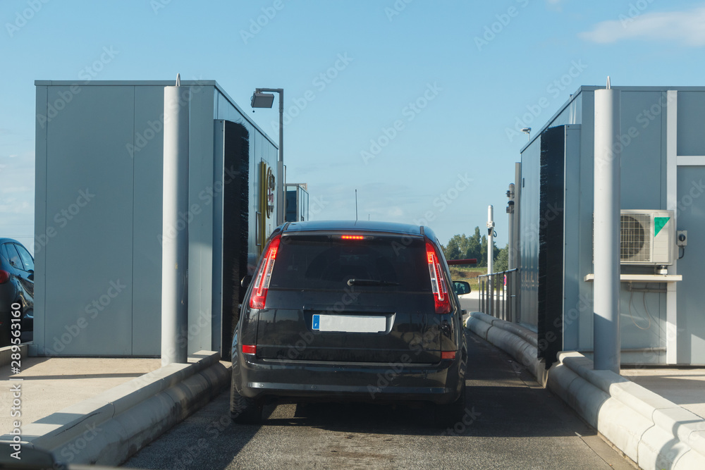 Car waiting to pay at the tollbooth