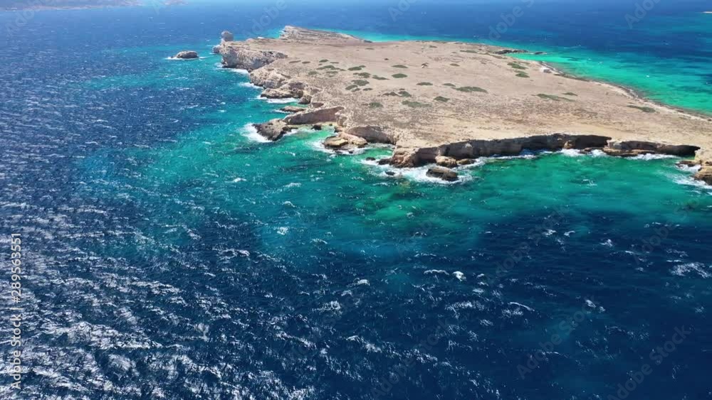 Aerial drone video of small islet of Glaronisi with paradise emerald clear sea rocky beaches, Koufonisi island, Small Cyclades, Greece Aerial drone video of small islet of Glaronisi with paradise emerald clear sea rocky beaches, Koufonisi island, Small Cyclades, Greece