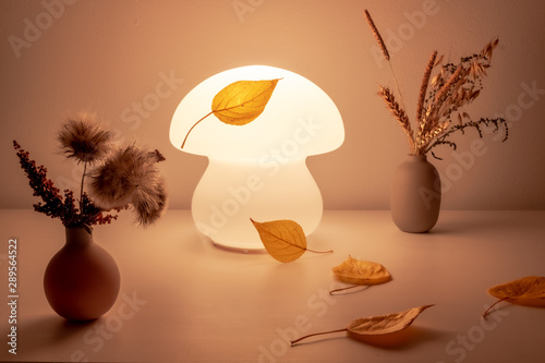 night lamp on a table of spring leaves