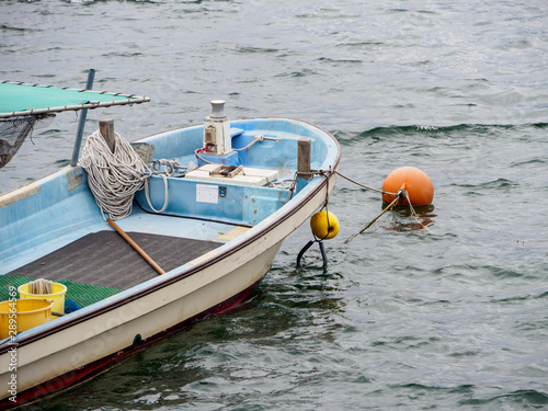 Wide closeup of a fisherman's boat out in the deep seas around Miyajima Island, Hiroshima, Japan. Travel and industry. photo