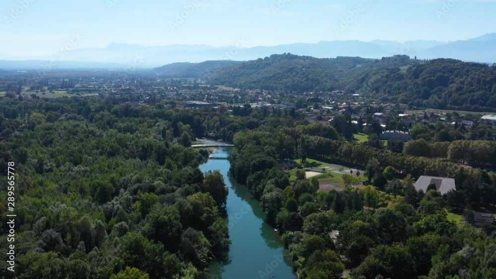 River Gave de Pau France aerial view Pyrenees in background Gelos village sunny day River Gave de Pau France aerial view Pyrenees in background Gelos village sunny day