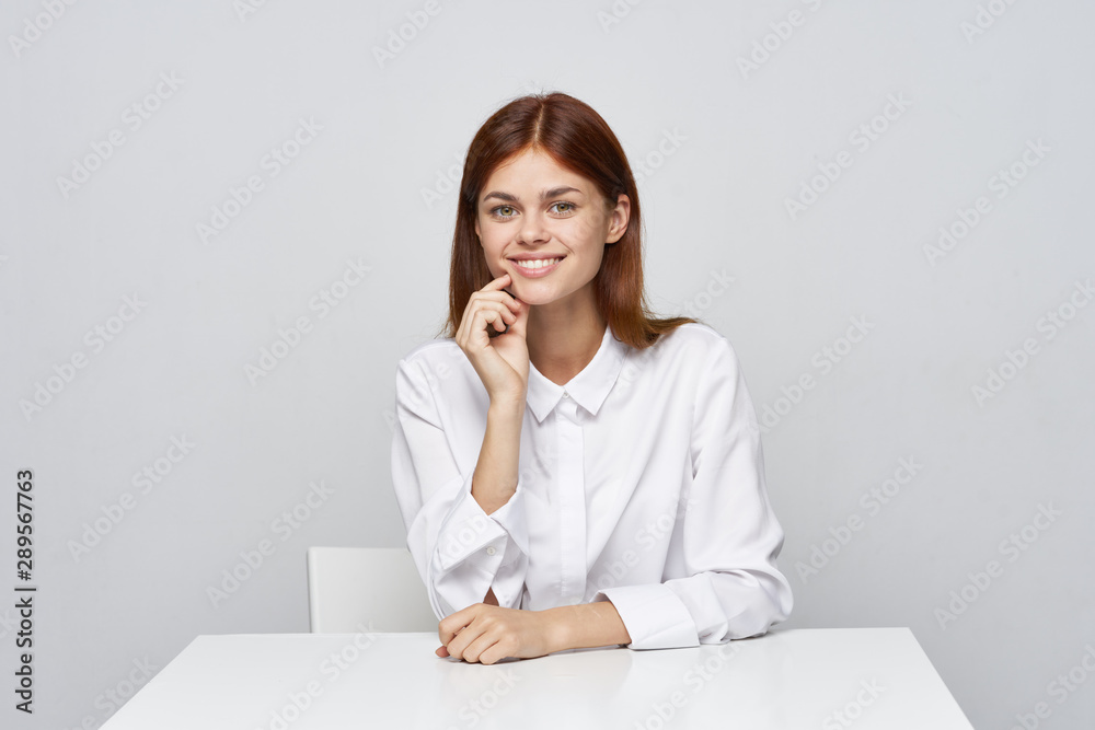 businesswoman sitting at her desk businesswoman sitting at her desk