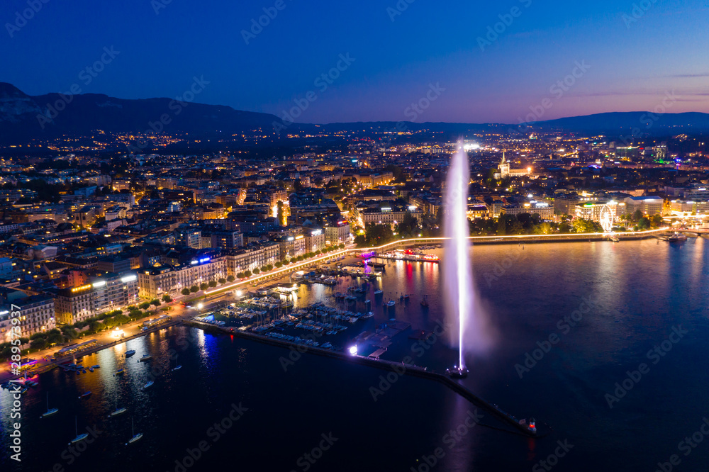 Aerial  night view of Geneva city water fountain in Switzerland
