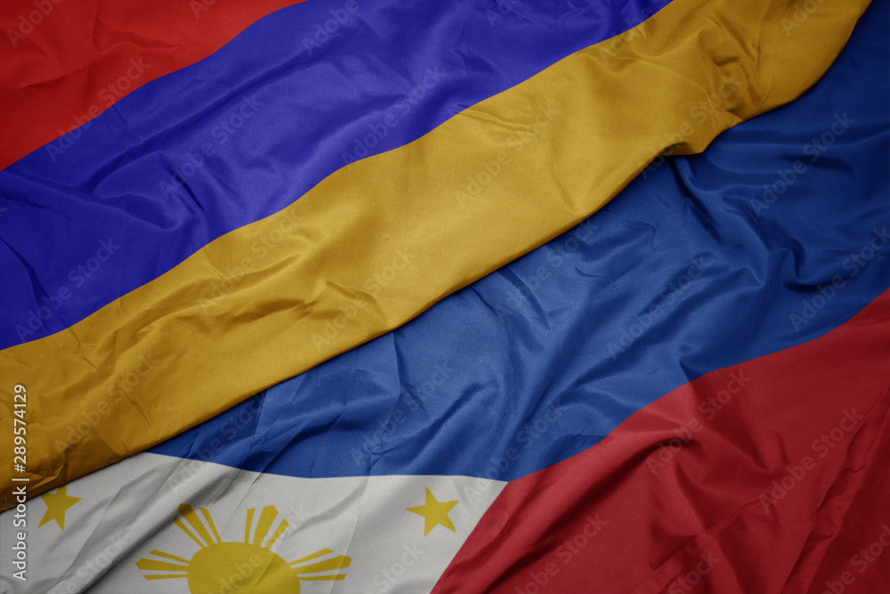 waving colorful flag of philippines and national flag of armenia. waving colorful flag of philippines and national flag of armenia.