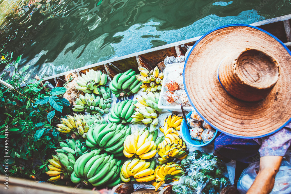 floating market - top view of boat full of fresh fruits on sale - obrazy, fototapety, plakaty 