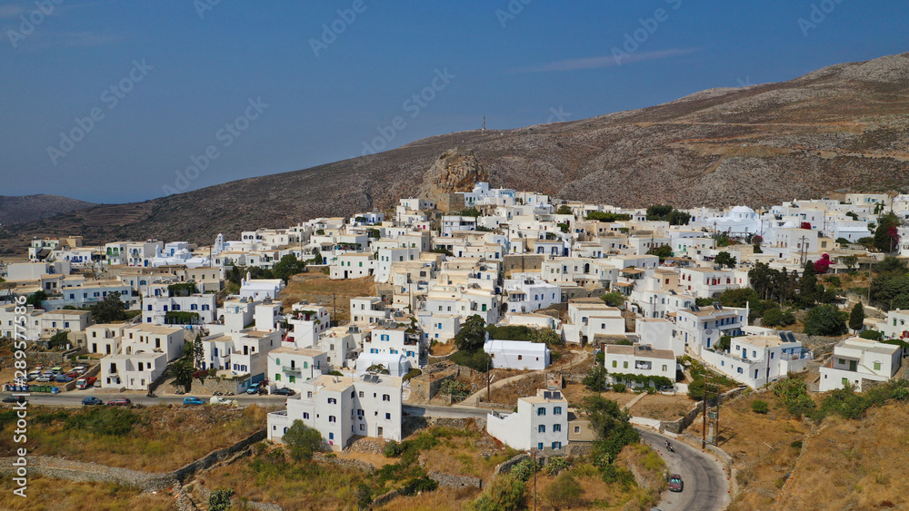 Aerial drone panoramic photo of picturesque main village or chora and castle of Amorgos island built on top of cliff overlooking the Aegean blue sea, Cyclades, Greece