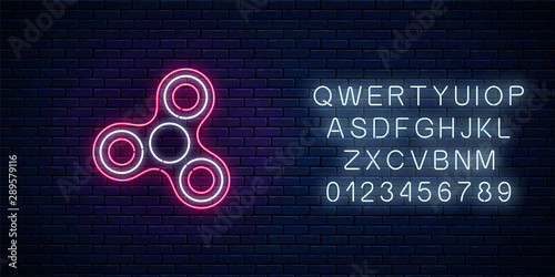 Glowing neon sign of fidget spinner with alphabet. Hand rotation antistress toy for relax. Twist bauble to making tricks