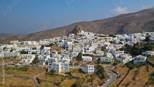 Aerial drone panoramic photo of picturesque main village or chora and castle of Amorgos island built on top of cliff overlooking the Aegean blue sea, Cyclades, Greece © aerial-drone
