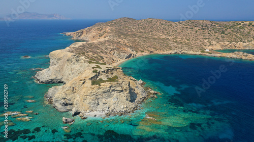 Aerial drone photo of secluded paradise beach of Gramvousa in small island of Gramvousa near Kalotaritissa with emerald clear sea, Amorgos island, Cyclades, Greece