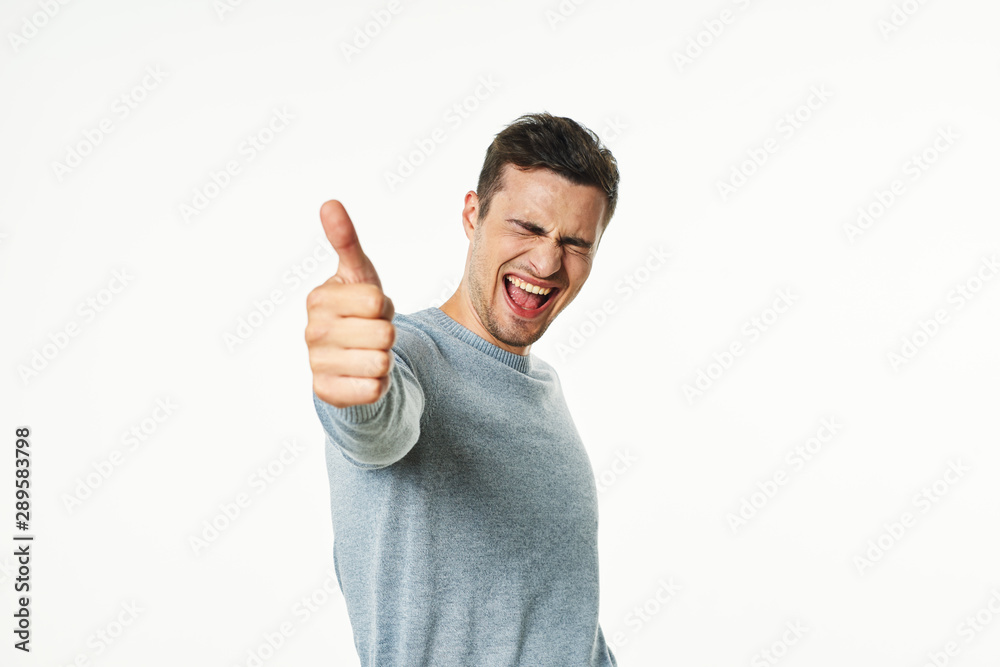young man with thumbs up young man with thumbs up