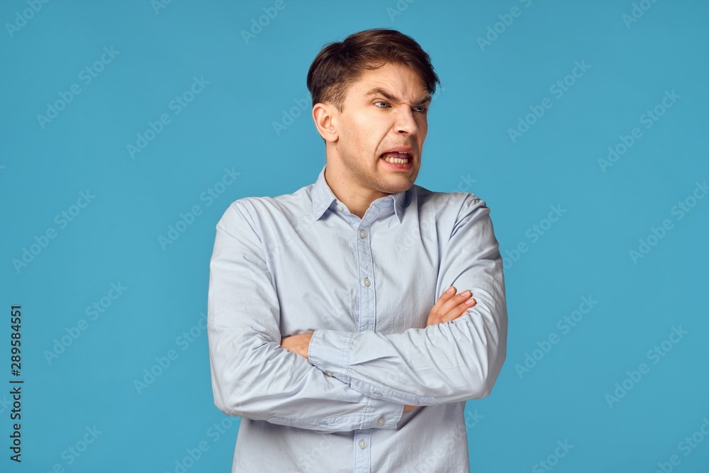 portrait of young man with arms crossed portrait of young man with arms crossed