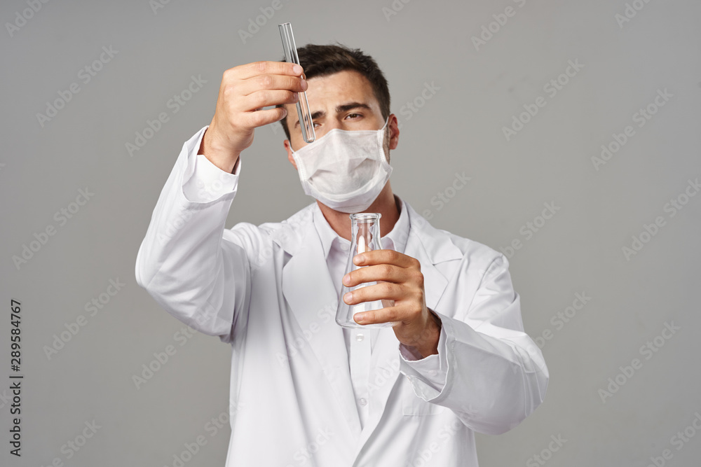 young doctor with protective mask young doctor with protective mask