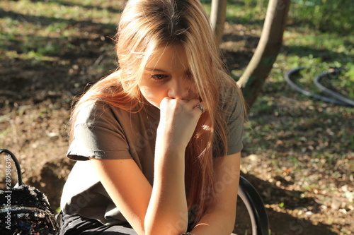 sad girl in the forest