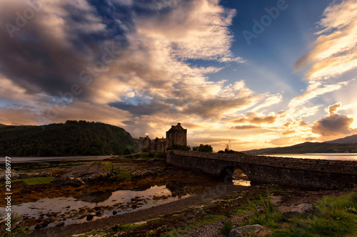 Scottish castle under a cloudy sunset