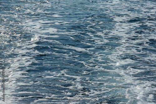 Wave pattern on the water surface of behind boat, background. Adriatic Sea