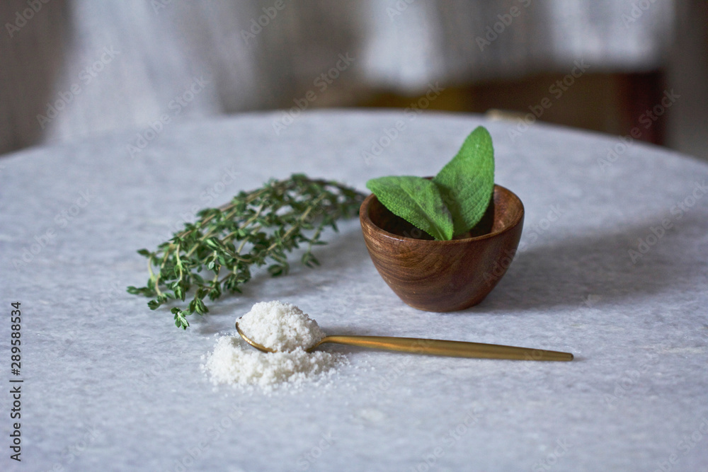 Herb Leaves in Bowl with Parmesan Cheese in Bowl Herb Leaves in Bowl with Parmesan Cheese in Bowl