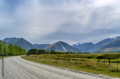 Dirt road through countryside in Glenorchy, New Zealand