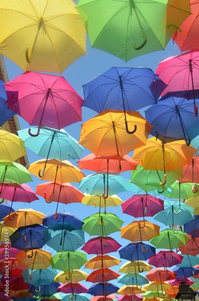 Covered by colorful umbrellas