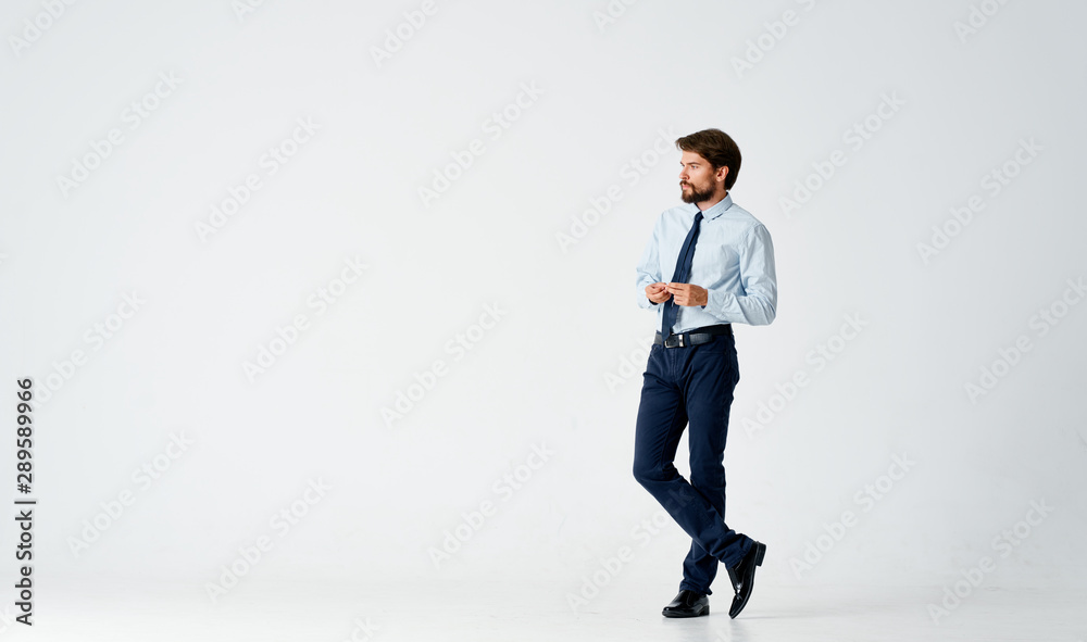 businessman standing in front of wall businessman standing in front of wall