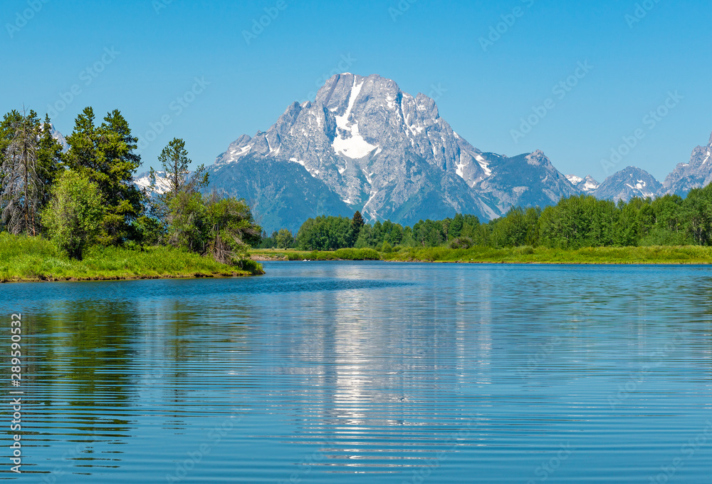 The majestic peaks of the Grand Tetons with a reflection in the Snake River by the Oxbow Bend, Grand Teton national park, Wyoming, USA.