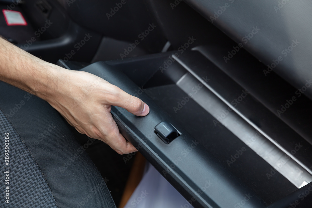 Driver Opening Empty Glovebox Compartment