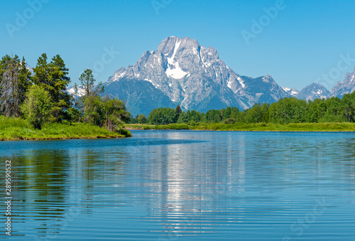 The majestic peaks of the Grand Tetons with a reflection in the Snake River by the Oxbow Bend, Grand Teton national park, Wyoming, USA. © SL-Photography