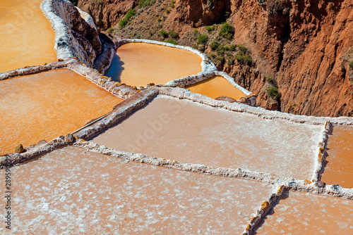 Close up of the Maras salt terraces with the best quality salt of the country, Cusco Province, Peru. photo