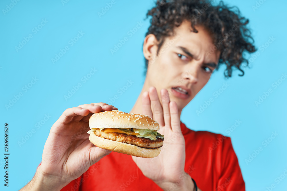 man eating hamburger