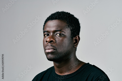 portrait of a young man isolated on black background