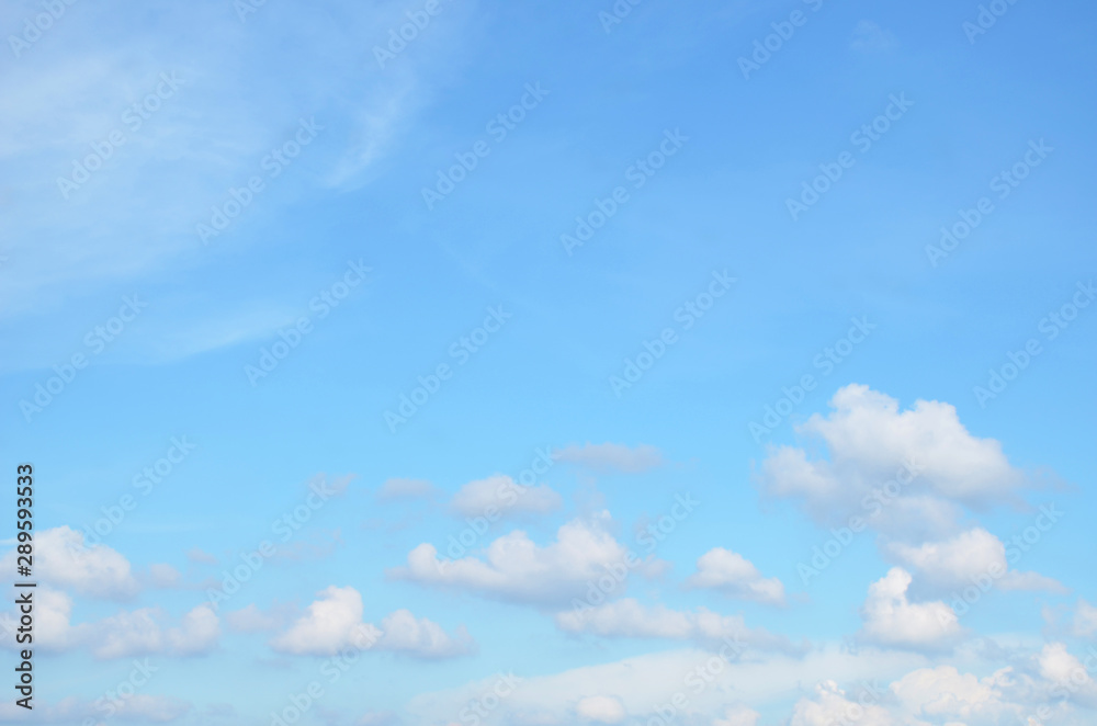 Subtle pastel background of clouds in blue sky  