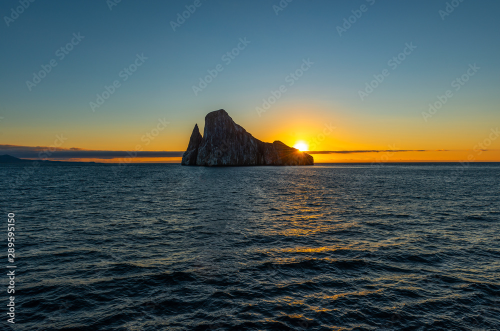 Landscape of the Kicker Rock stone formation at sunset, Galapagos Islands National Park, Ecuador.