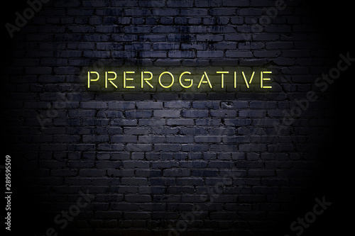 Fotografia Highlighted brick wall with neon inscription prerogative