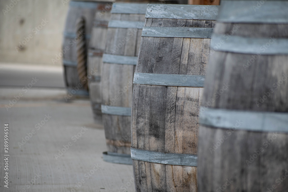 Wine barrels stacked in a row Wine barrels stacked in a row