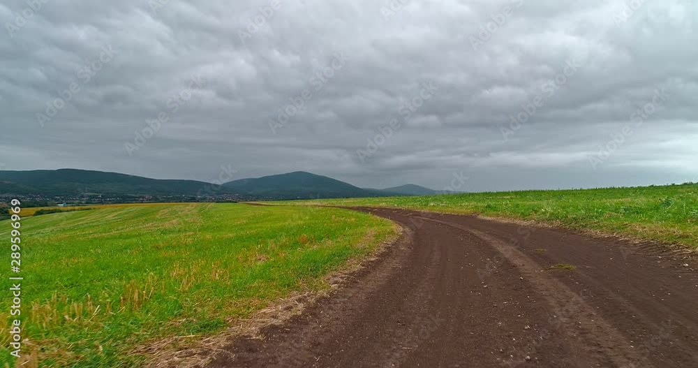 Drone view of the North Hungarian landscape of the Muzsla, part of Matra. Hills and fields of agricultural view with roads in the distance view. Cloudy view after rain with fog in the forest. Drone view of the North Hungarian landscape of the Muzsla, part of Matra. Hills and fields of agricultural view with roads in the distance view. Cloudy view after rain with fog in the forest.