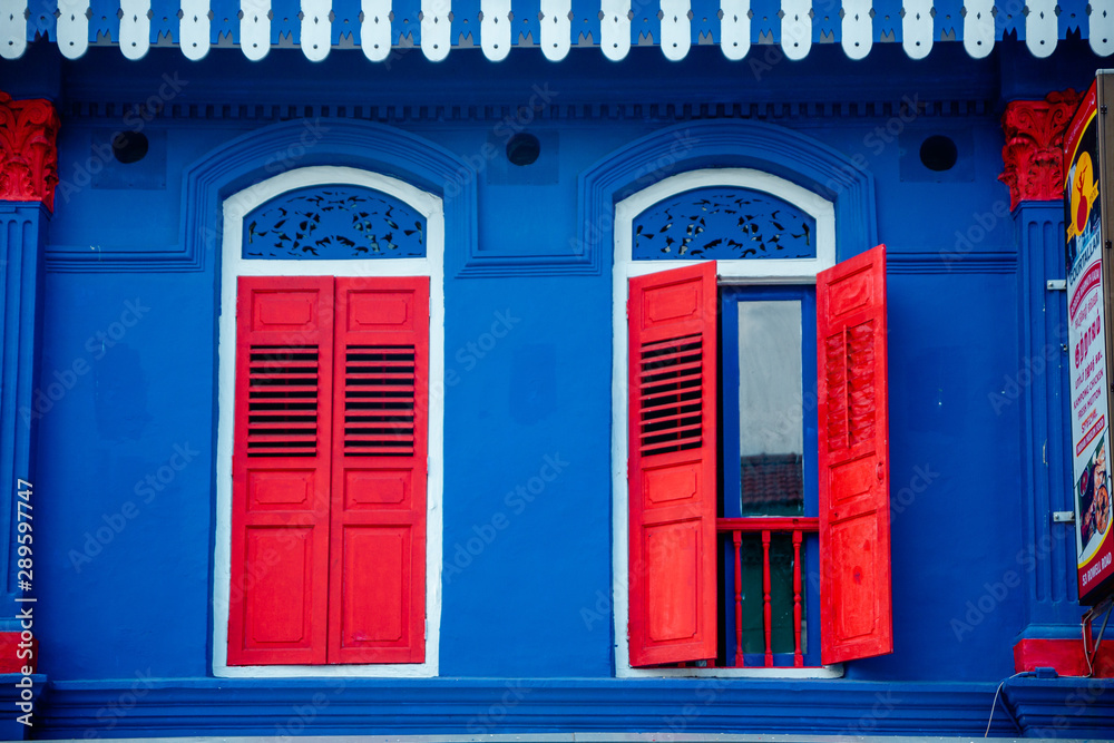 Obraz premium window with red shutters