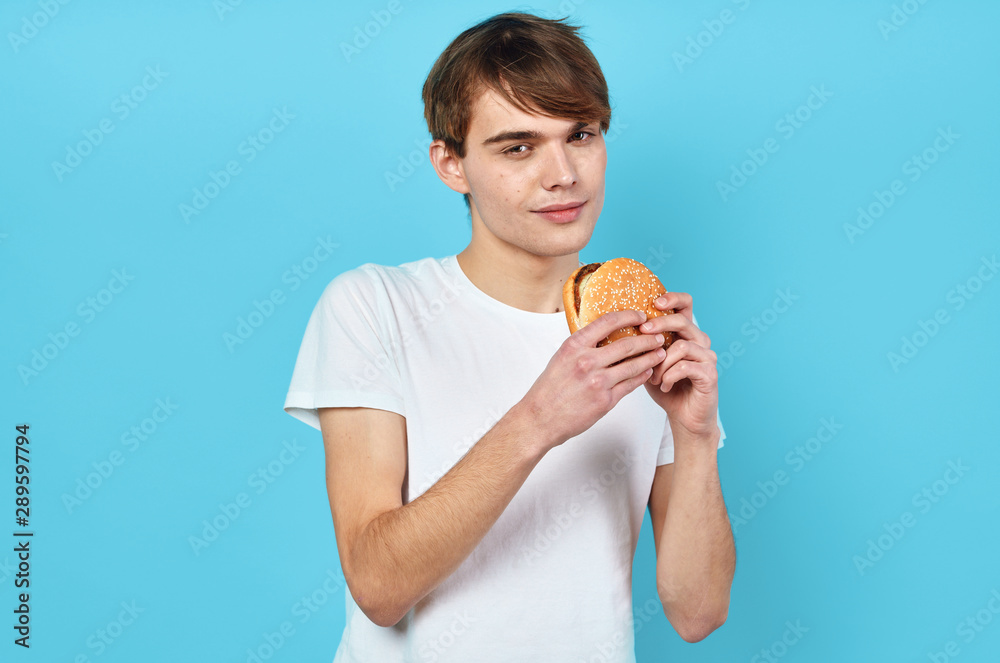 young man with hamburger