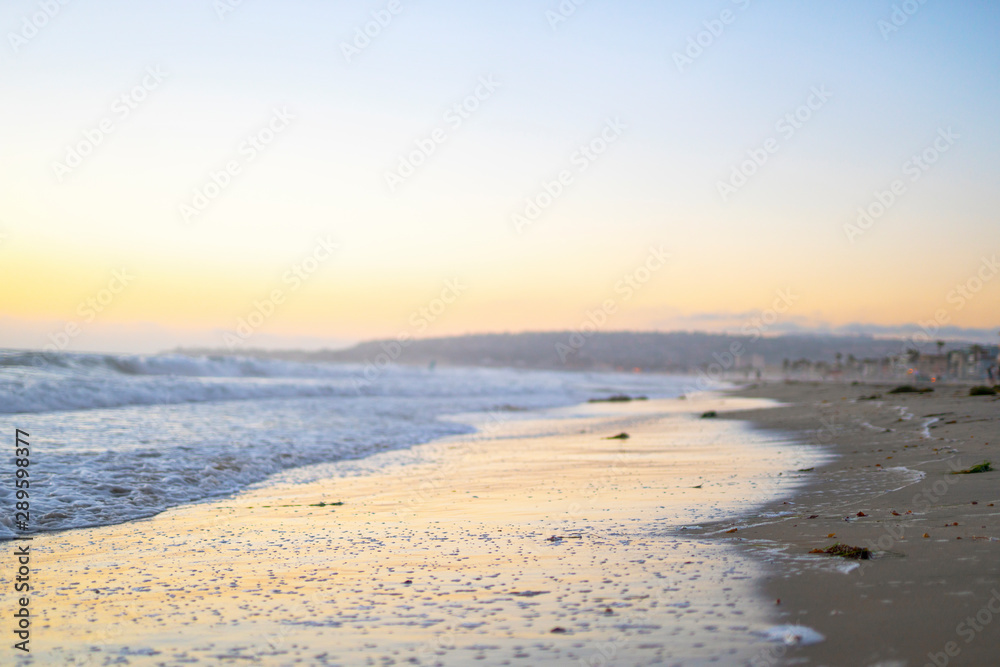 Beautiful sunset beach coastal landscape yellow and blue
